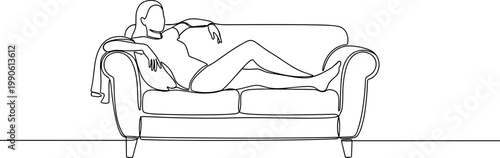 Woman Relaxing on a Sofa Alone.