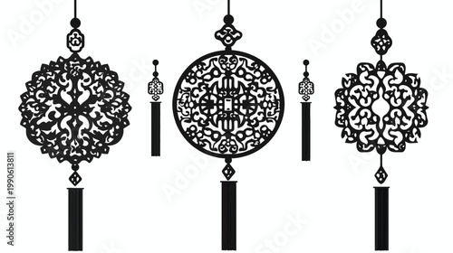 Black ornate decorative shapes with intricate details, hanging from above, tassel-like bottoms