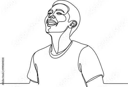 Young man looking up smiling.