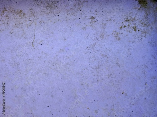 Abstract background of an old worn out light purple surface with scratches and dirt. Grunge blank rough concrete or plastic texture for design copy space.