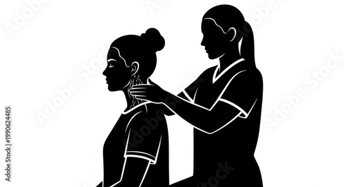Physical therapist massaging patient neck and shoulder area.
