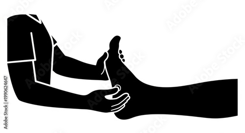 Physical therapist examining a patients foot and ankle in silhouette.