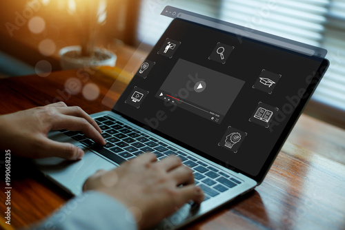 Vászonkép Business professional using online video learning platform on laptop for digital education, remote training and multimedia courses