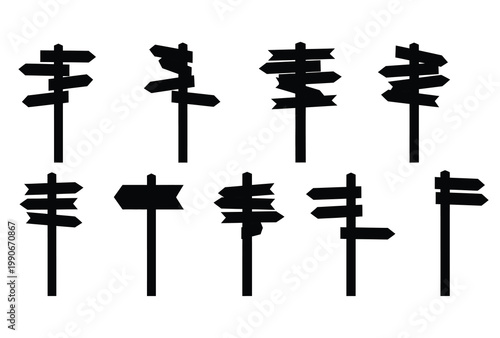 Multiple wooden direction signs point various ways creating a visual puzzle silhouette