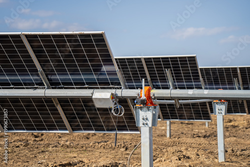 фотографія Solar farm tracker hardware showing PV modules, torque beam, galvanized pile, ju