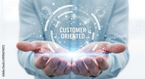 Embracing a Customer-Oriented Approach Hands Presenting a Holographic Display with the Phrase Customer Oriented Signifying Service Excellence and Client Satisfaction