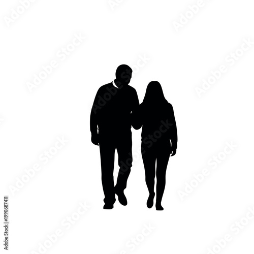 Silhouette of a couple walking arm in arm.
