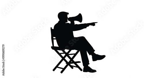 A film director gives instructions while seated captured in striking silhouette