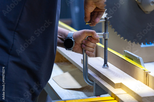 Canvas Print Carpenter Clamping Wooden Board on Workbench