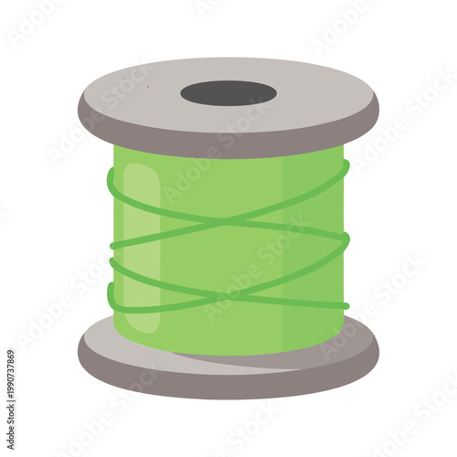 Vivid green thread winds casually around a light grey spool for sewing and crafting