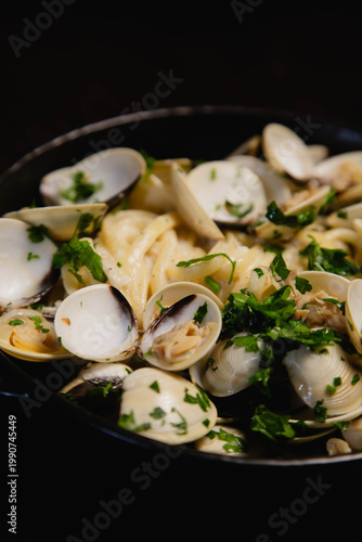 Delicious Mediterranean dinner with spaghetti alle vongole and fresh parsley