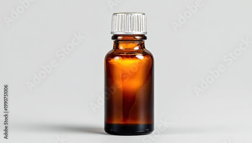 Amber glass dropper bottle with white cap, filled with dark liquid