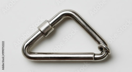 Metallic triangular carabiner with a screw-gate closure and ring on a white background