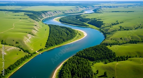 Aerial view of a winding river through green landscapes and forests