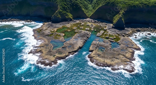 Aerial view of a rocky island with tide pools and waves crashing against the shore surrounded by lush greenery and steep cliffs rising from the sea