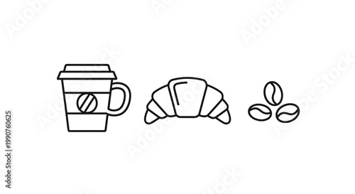 Coffee cup with croissant and beans.