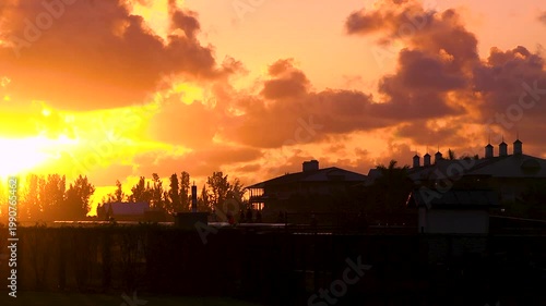 Beautiful orange sunrise on a horse farm