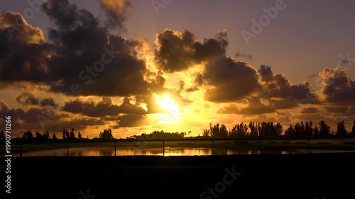 Beautiful orange sunrise on a horse farm