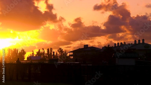 Beautiful orange sunrise on a horse farm