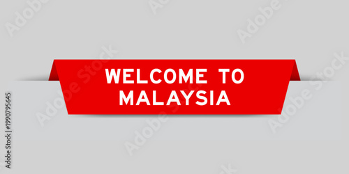 Red color inserted label with word welcome to malaysia on gray background