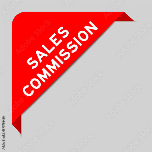 Red color of corner label banner with word sales commission on gray background
