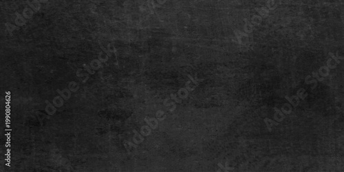Dark gray black plaster wall textured background with subtle gradient and rough surface