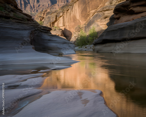 River flowing through a narrow canyon with sunlit rock formations
