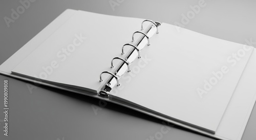Wide Angle View Of Open Blank Ring Binder On Smooth Grey Table