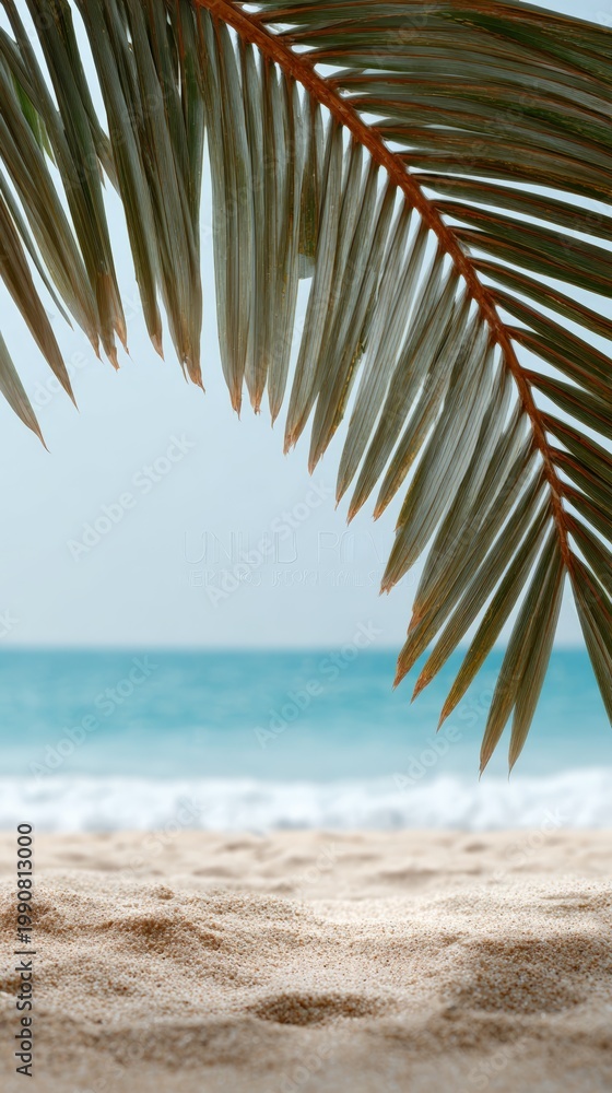 Fototapeta premium Golden sandy coastline extending toward turquoise waters, tropical palm frond silhouetting peaceful horizon, representing pristine island paradise landscape