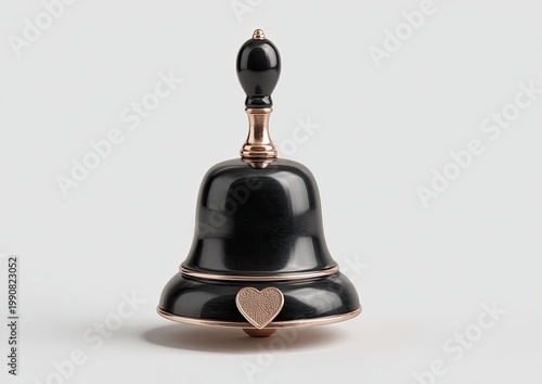 Elegant black metal bell with polished wood handle and subtle heart accent