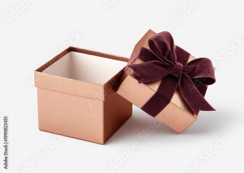 Opened copper gift box with rich plum ribbon, showcasing its empty interior