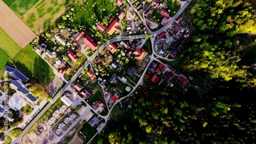 top down aerial village and forest contrast