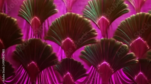 A vibrant, geometric pattern featuring layered fan-like shapes in green and pink hues, creating a glowing effect