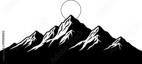 Jagged mountain peaks with rising sun silhouette