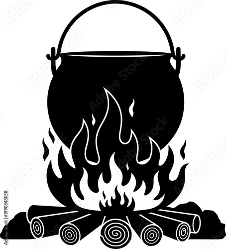 Large cauldron silhouette hanging over a burning wood campfire