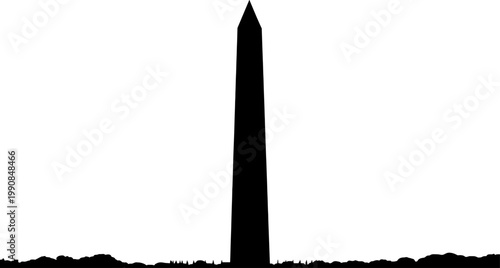 Tall stone obelisk monument silhouette against the horizon