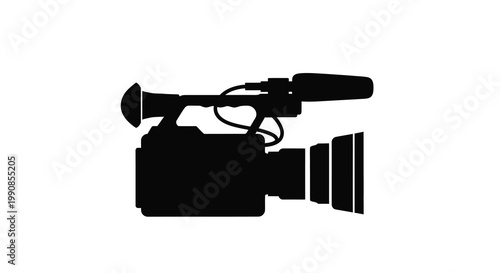 Silhouette of a professional video camera with attached microphone