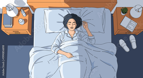 Young woman sleeping peacefully in her comfortable bed at night seen from a top down birds eye perspective.