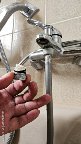Canvastavla Limescale buildup in faucet aerator, hard water calcium deposits clogging tap fi
