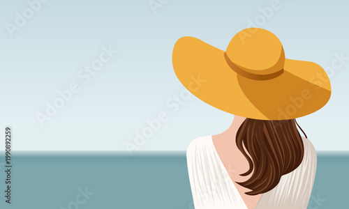  Woman in a summer hat on the seashore.