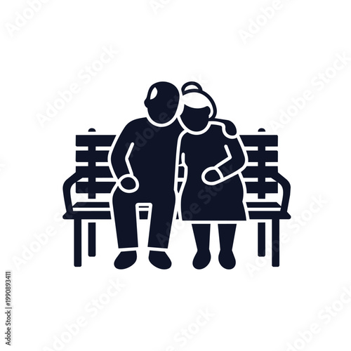 Elderly couple sitting on bench with walking sticks, leaning on each other.