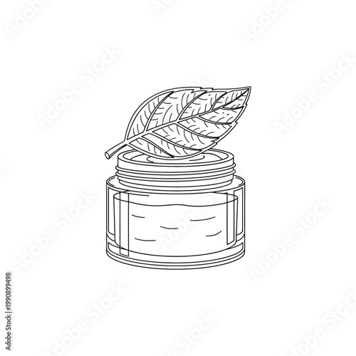 A jar of cream with a leaf on top.