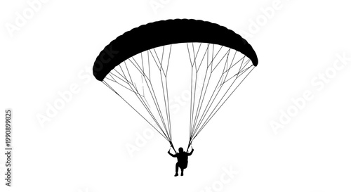 A dramatic black silhouette of a paraglider in mid air silhouette