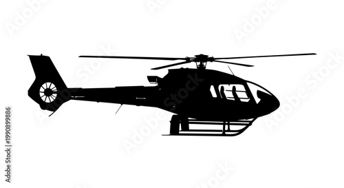 A black helicopter in flight showcasing a dramatic silhouette