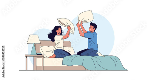 Joyful young couple in casual clothes having a playful pillow fight while kneeling on their bed in a bright and cozy bedroom.