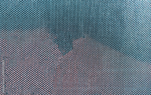 a background consisting of a fine grid pattern in two shades of pastel colours, pale blue and pale pink