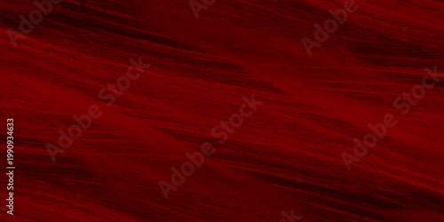 A luxurious red silk and satin fabric texture creates a dark grunge wallpaper design with a natural grain pattern reminiscent of old timber board material for an artistic red background
