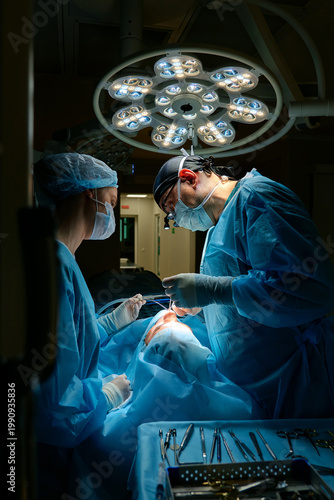 plastic surgeon performs surgery in the operating room