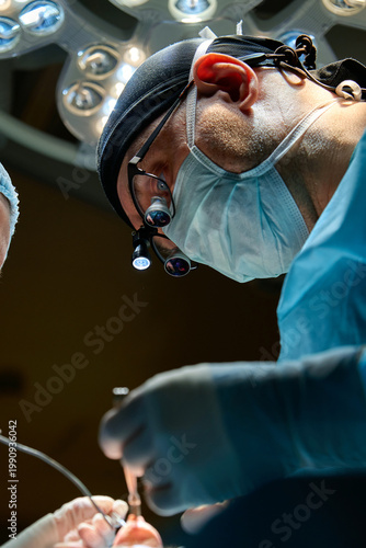 plastic surgeon performs surgery in the operating room