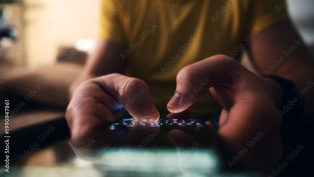 Fototapeta premium Man Tapping And Typing Message On Smartphone Screen At Home